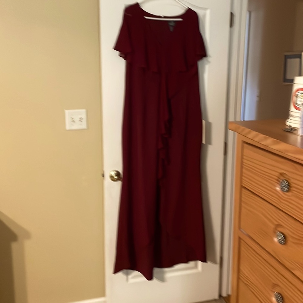 Adrian Papell burgundy gown.Slit in front give the dress a high/low effect. New.
